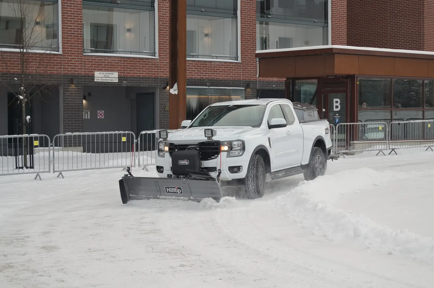 A pickup truck fitted with a snowplow