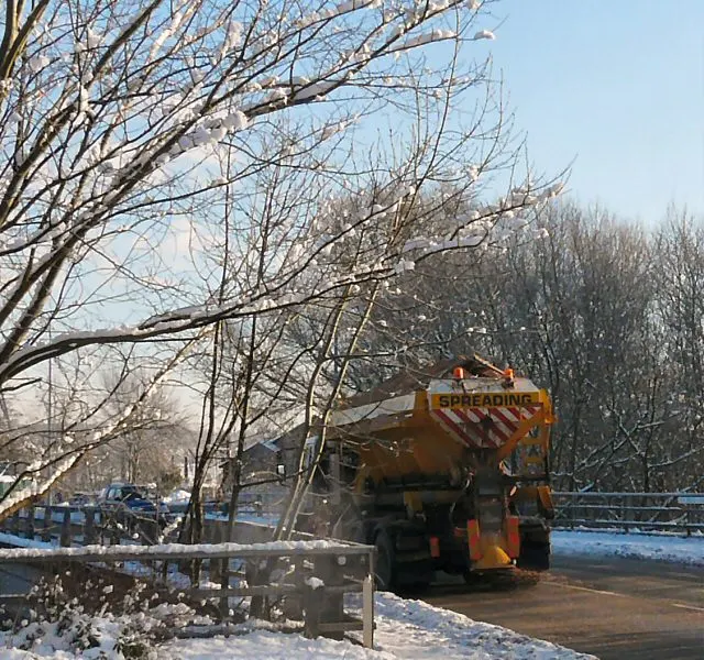 Salt being spread on a walkway